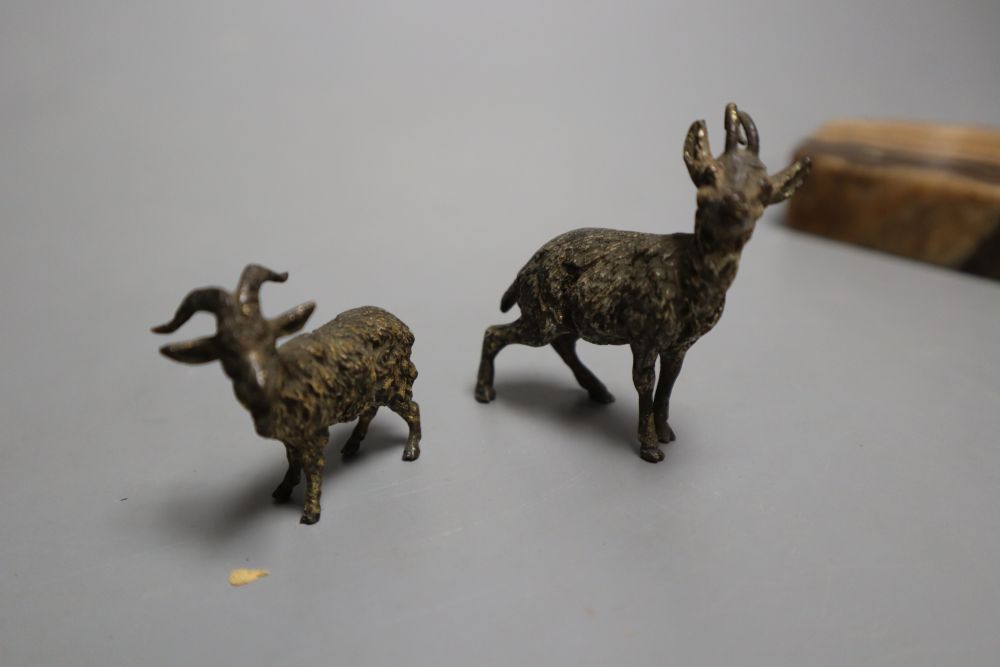 A carved boxwood watch stand, two cold painted bronze goats, an agate paperweight and a cast seated youth, watch stand 10cm